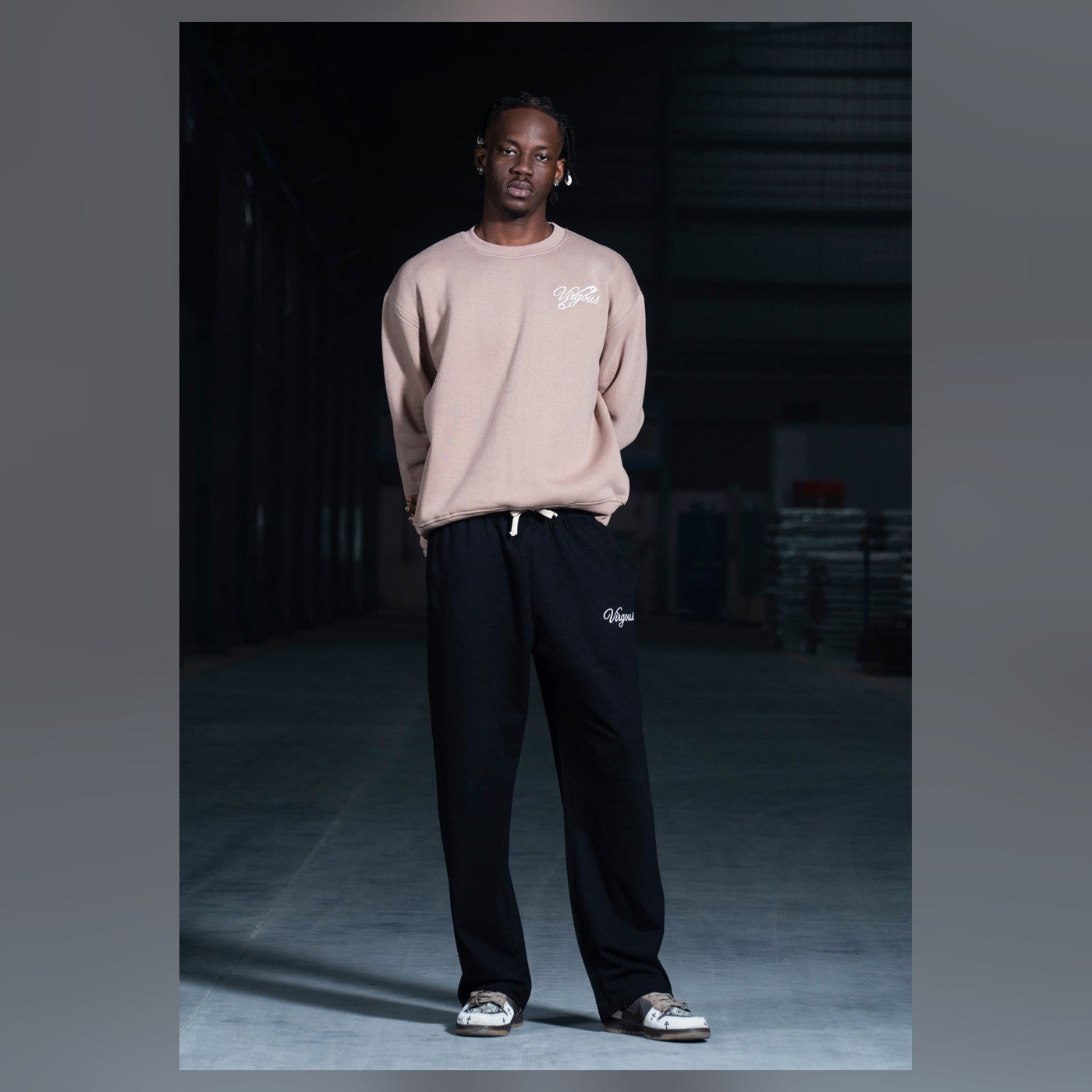 Man wearing Virgous wide-leg joggers and a sweatshirt